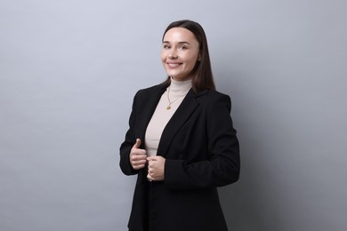 Photo of Portrait of businesswoman on light grey background