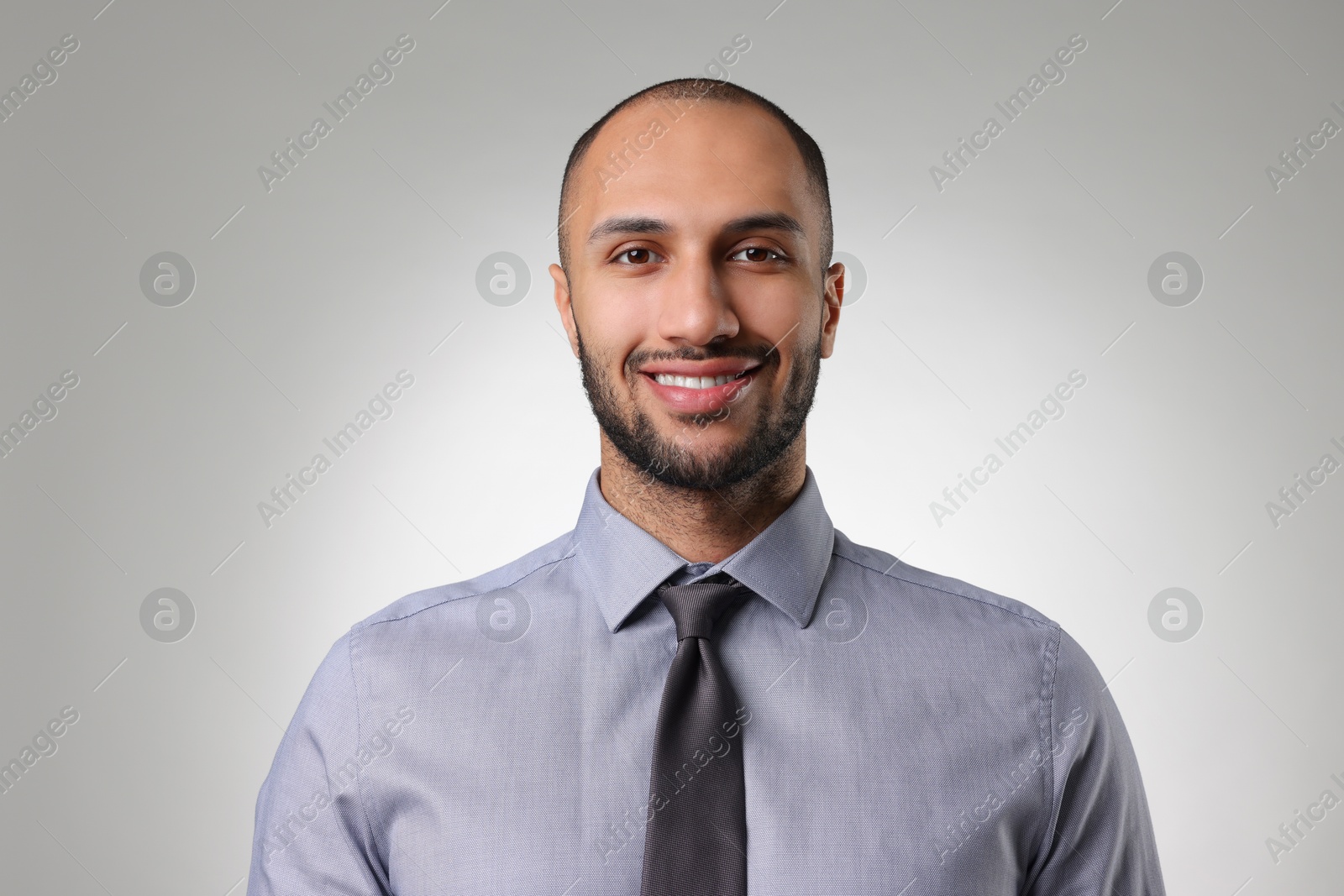 Photo of Portrait of businessman on light gray background