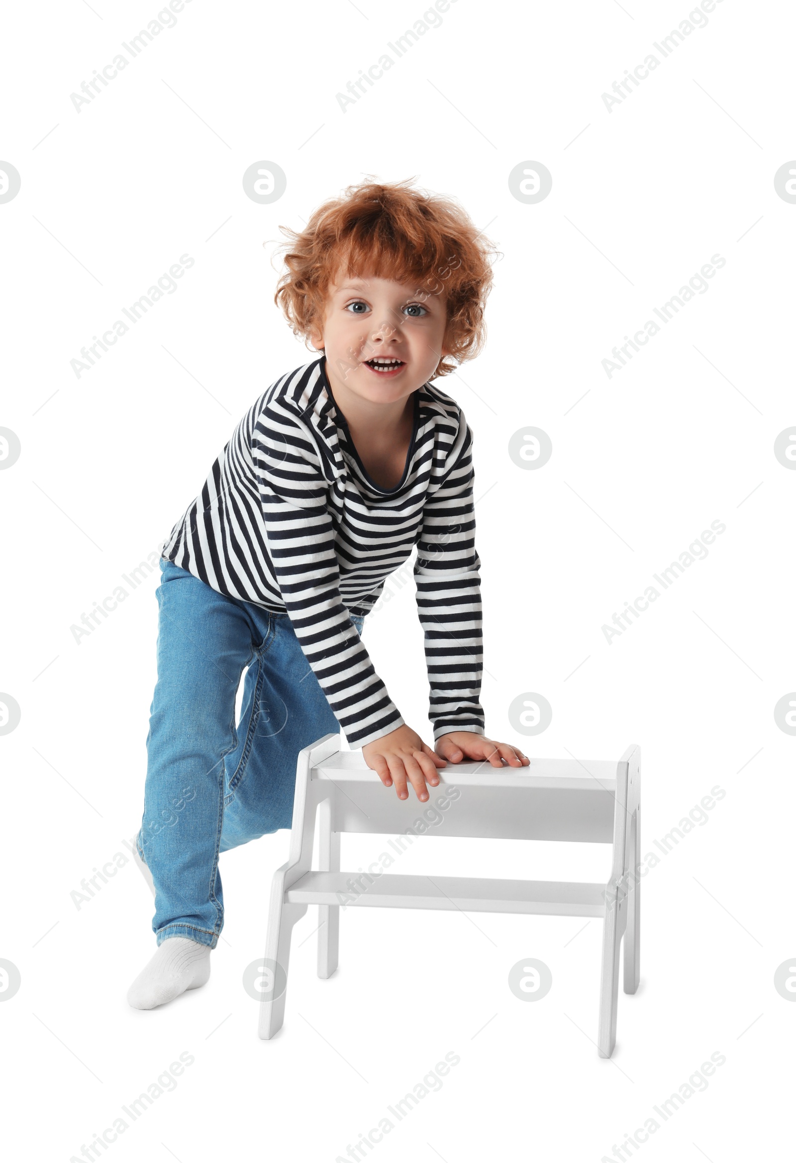 Photo of Little boy with step stool on white background