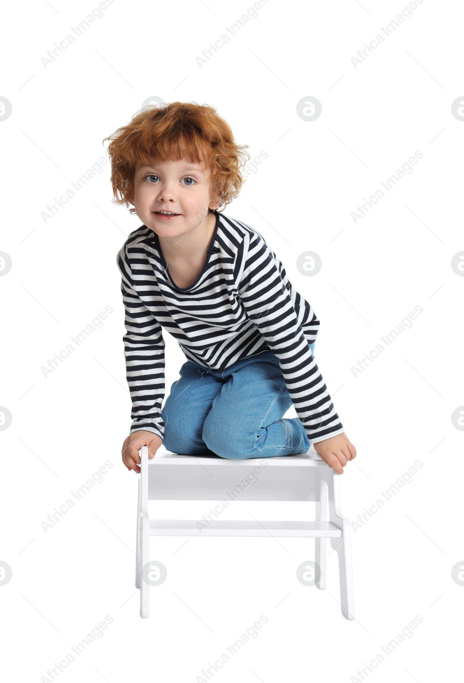 Photo of Little boy with step stool on white background