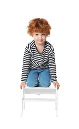 Photo of Little boy with step stool on white background