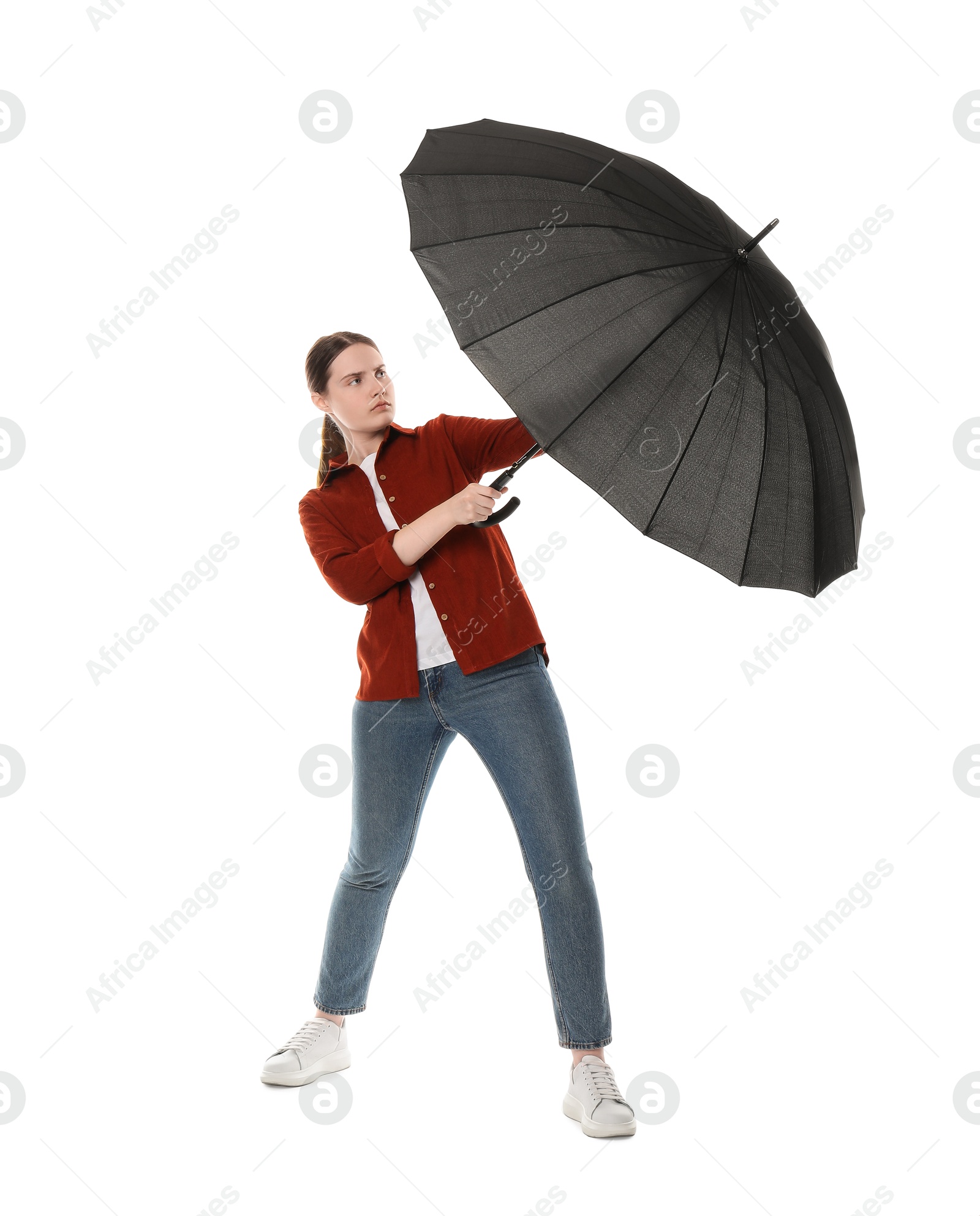 Photo of Young woman with black umbrella on white background