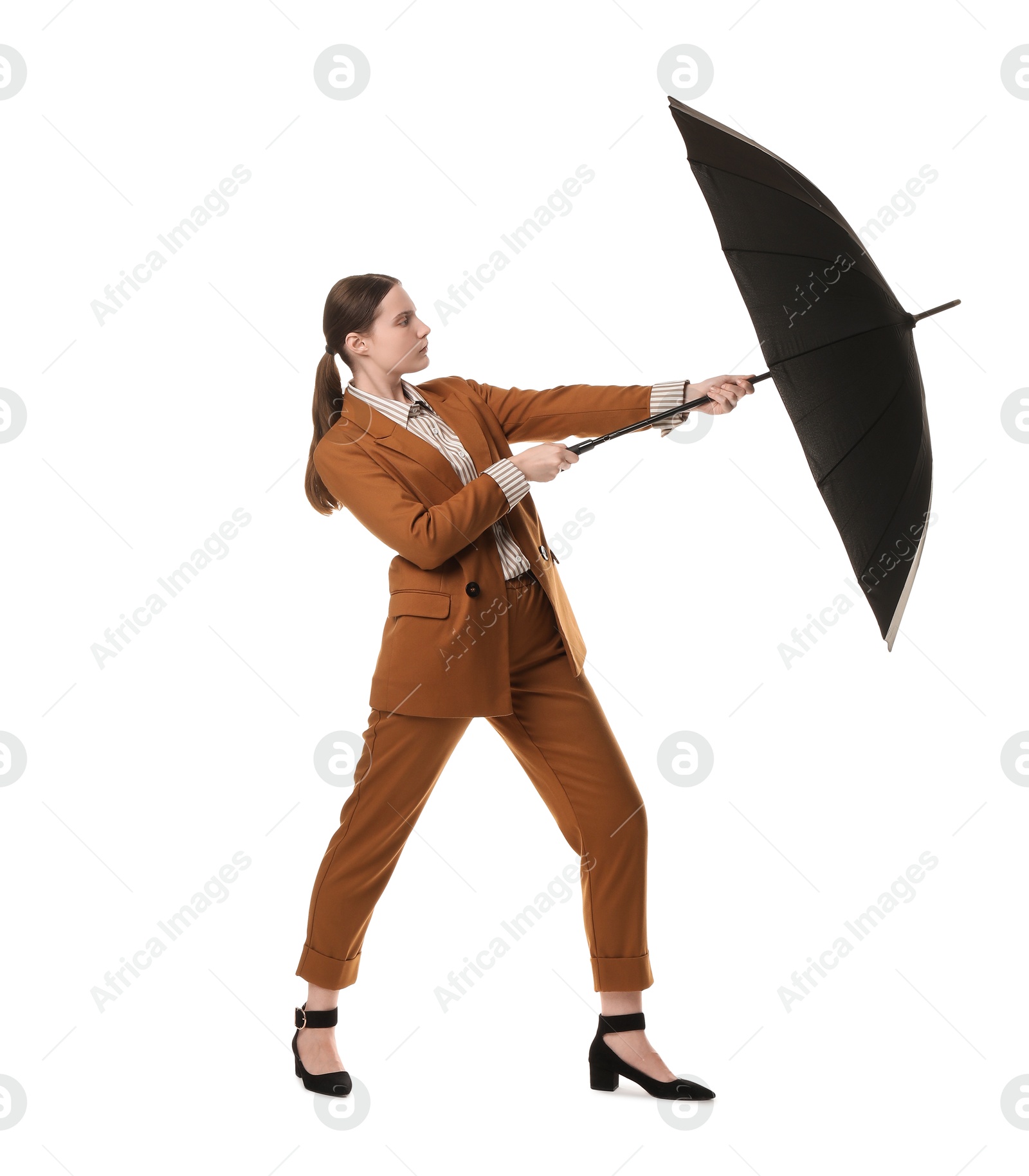 Photo of Young woman with black umbrella on white background