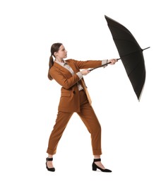 Photo of Young woman with black umbrella on white background