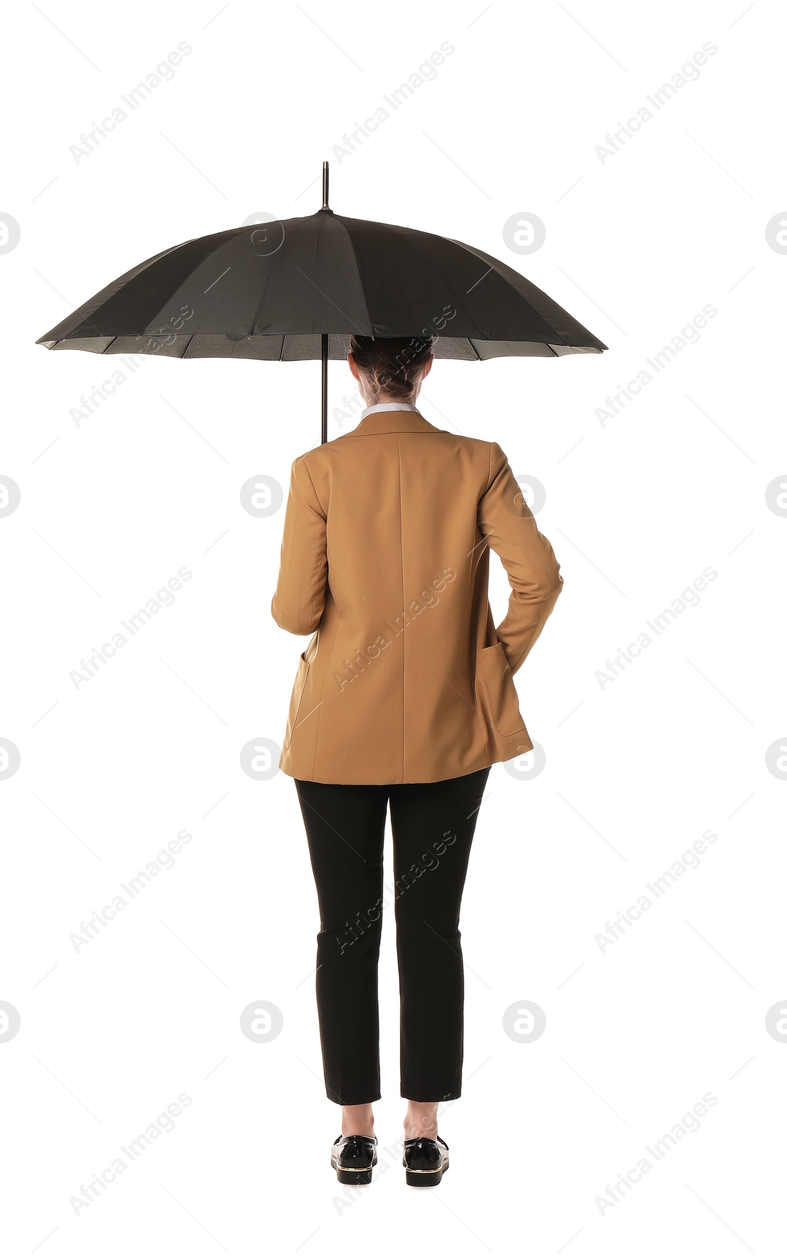 Photo of Young woman with black umbrella on white background, back view