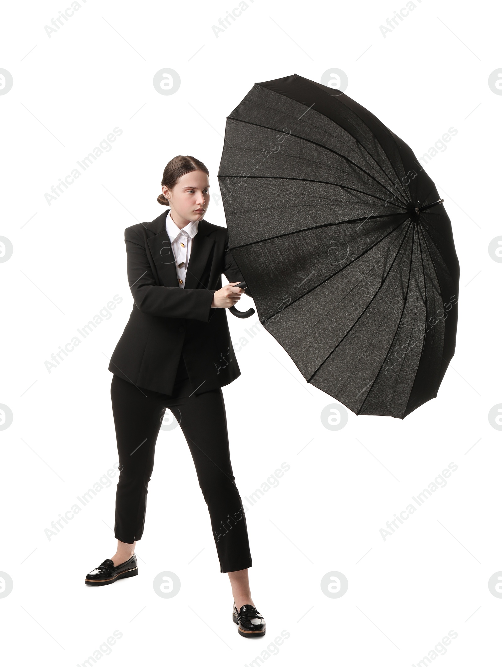 Photo of Young woman with black umbrella on white background