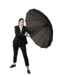 Young woman with black umbrella on white background