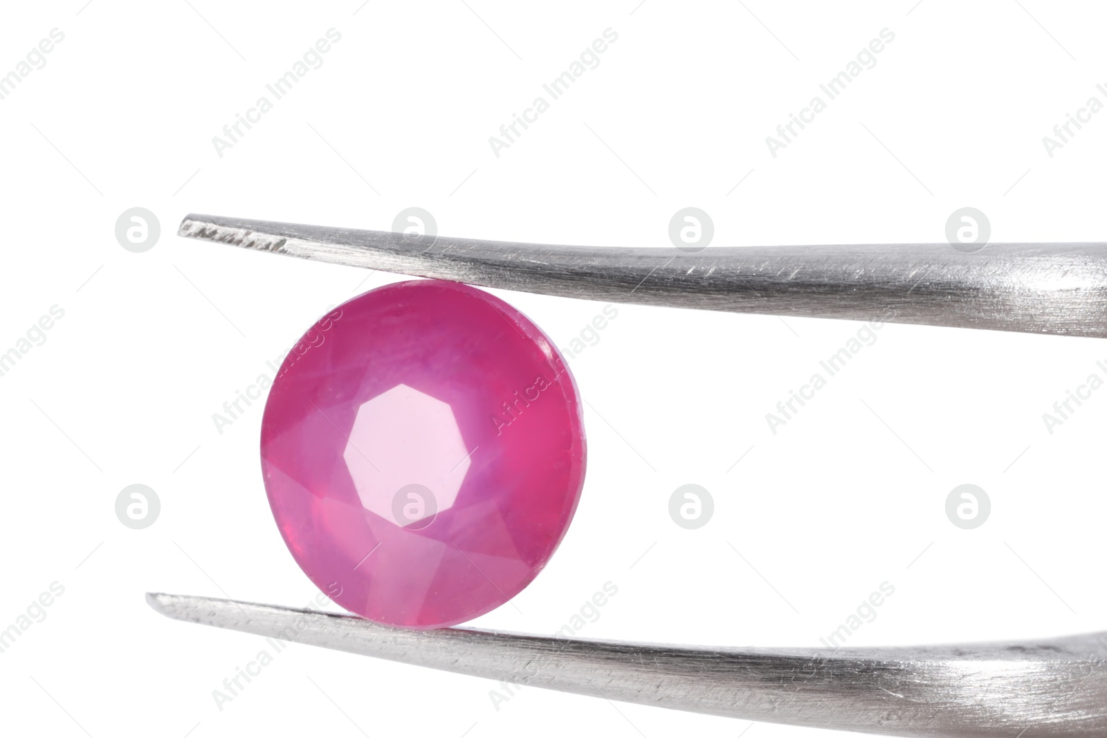 Photo of Tweezers with shiny pink gemstone isolated on white