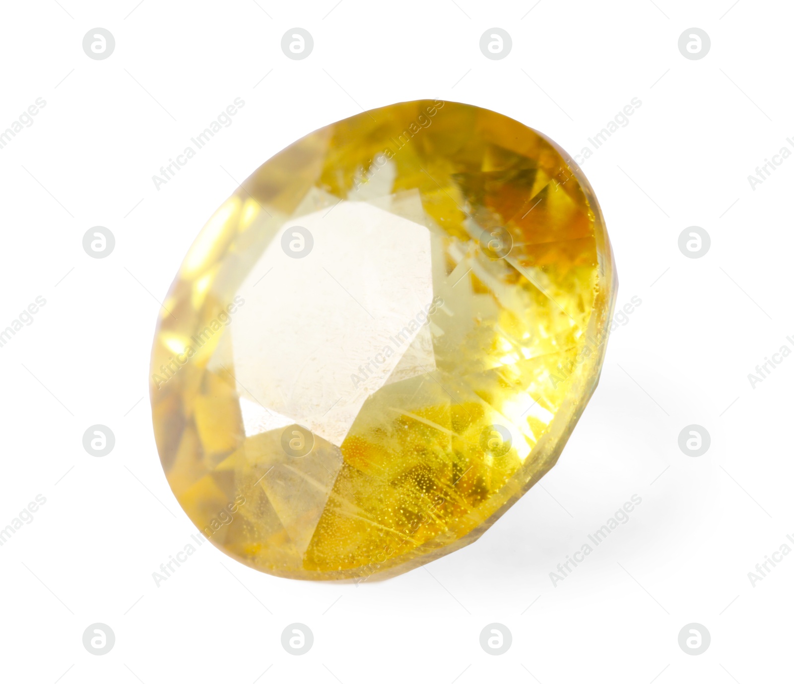 Photo of One shiny yellow gemstone isolated on white