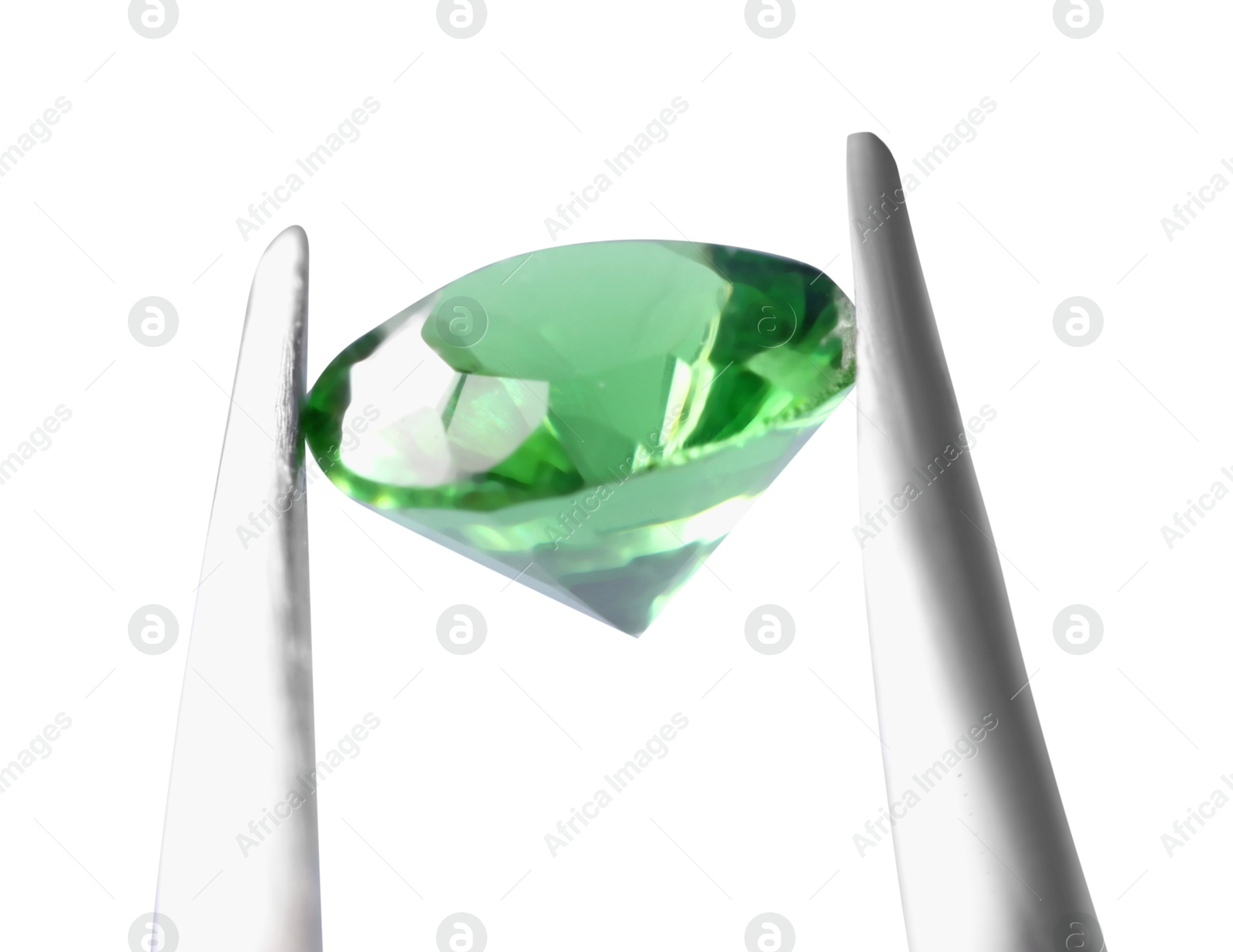 Photo of Tweezers with shiny green gemstone isolated on white