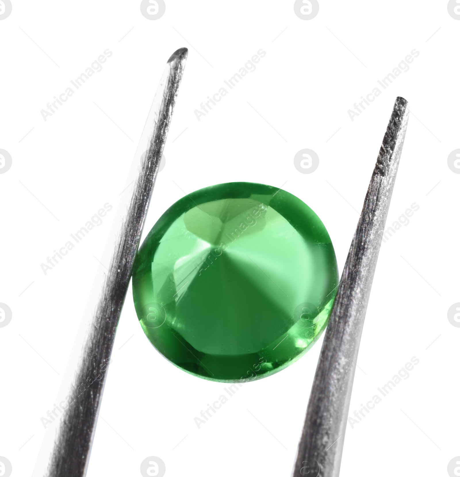 Photo of Tweezers with shiny green gemstone isolated on white