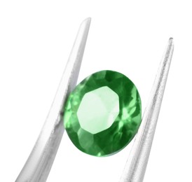 Photo of Tweezers with shiny green gemstone isolated on white