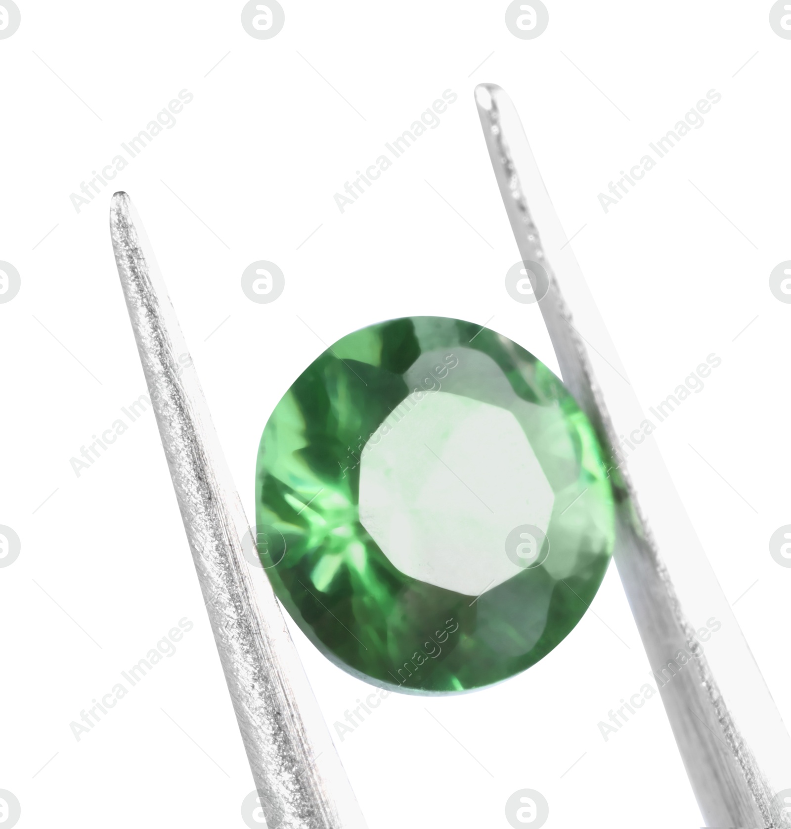 Photo of Tweezers with shiny green gemstone isolated on white