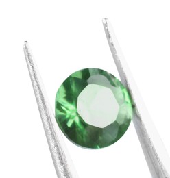 Photo of Tweezers with shiny green gemstone isolated on white