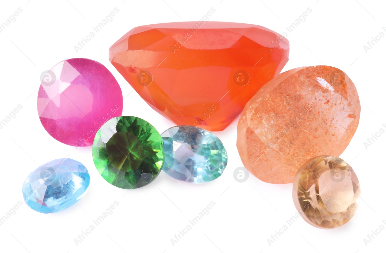 Photo of Different colorful shiny gemstones isolated on white