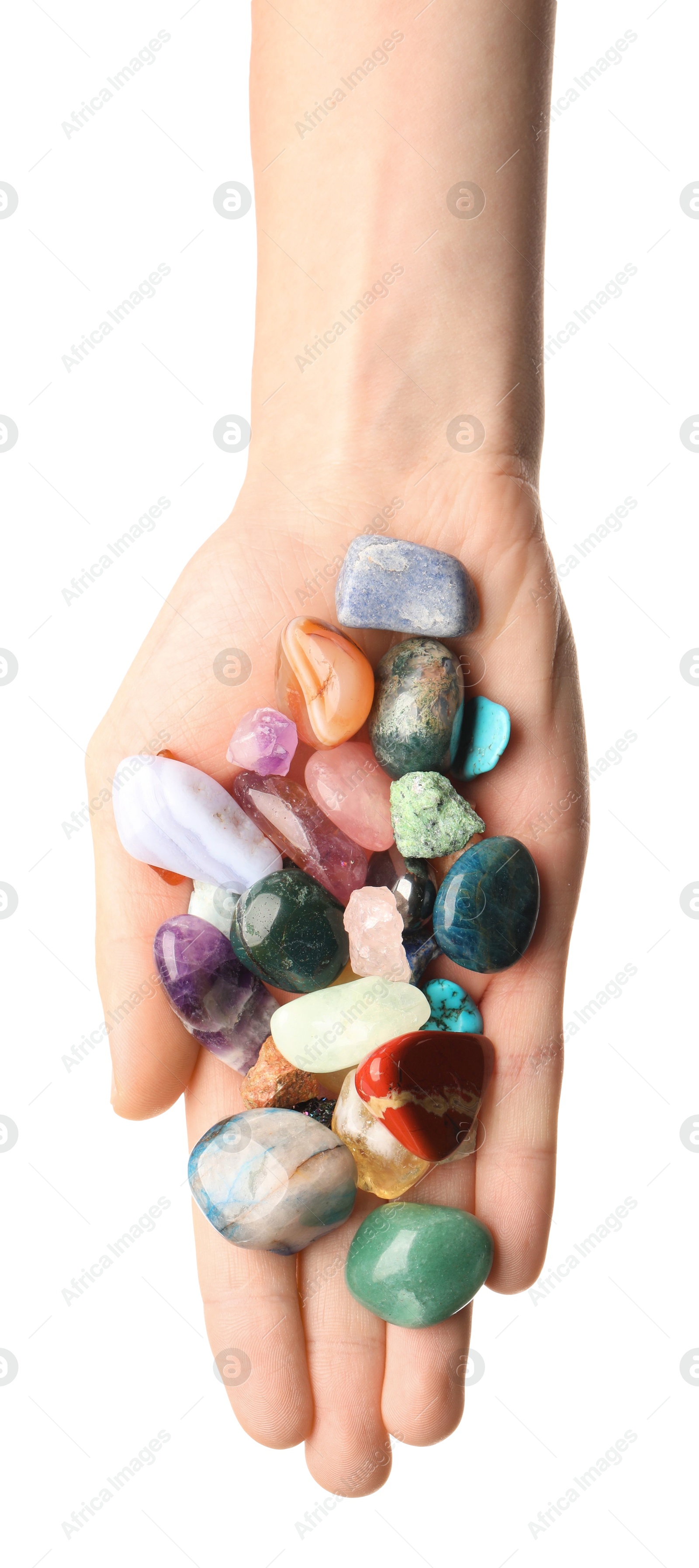 Photo of Woman holding different natural mineral stones on white background, top view