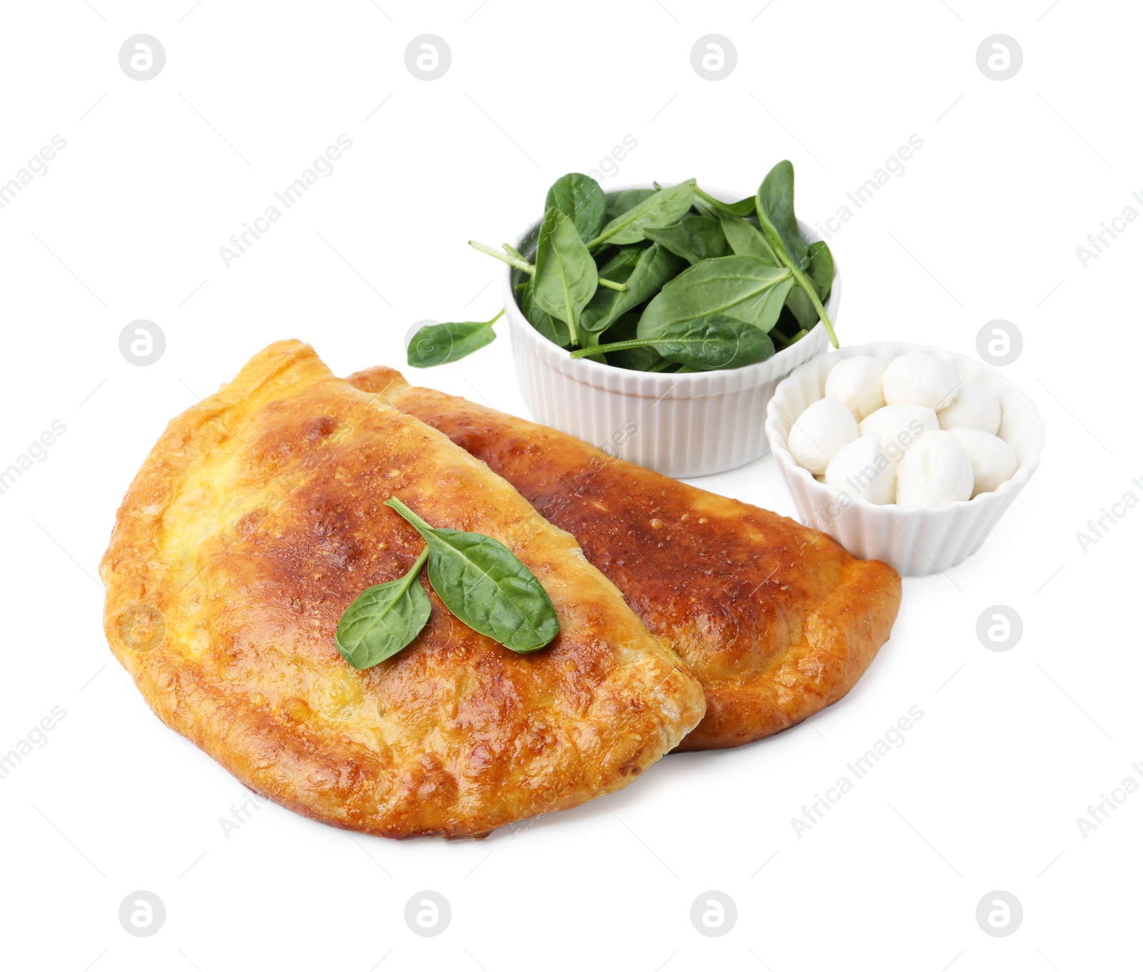 Photo of Tasty calzones with basil and mozzarella cheese isolated on white