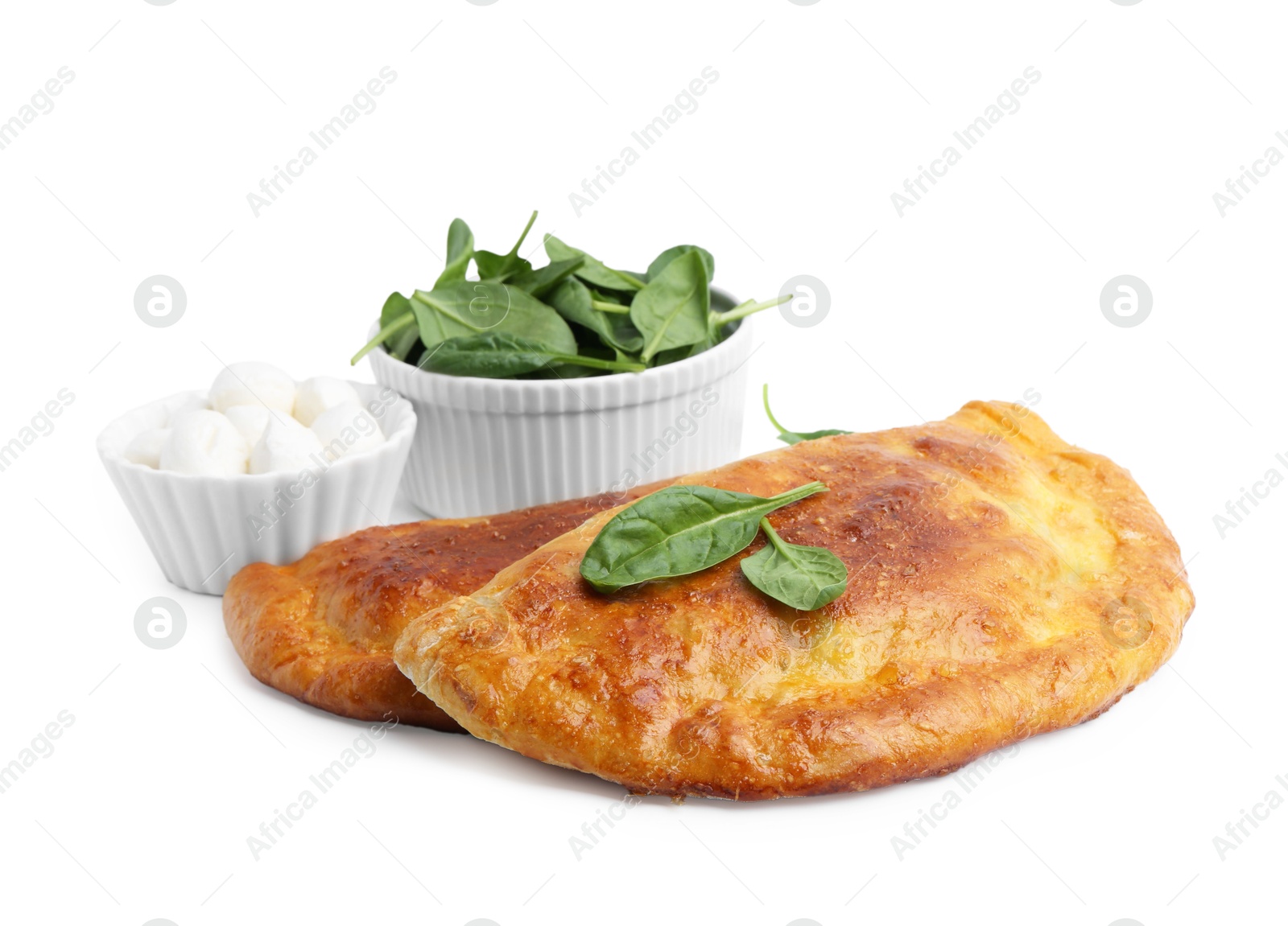 Photo of Tasty calzones with basil and mozzarella cheese isolated on white