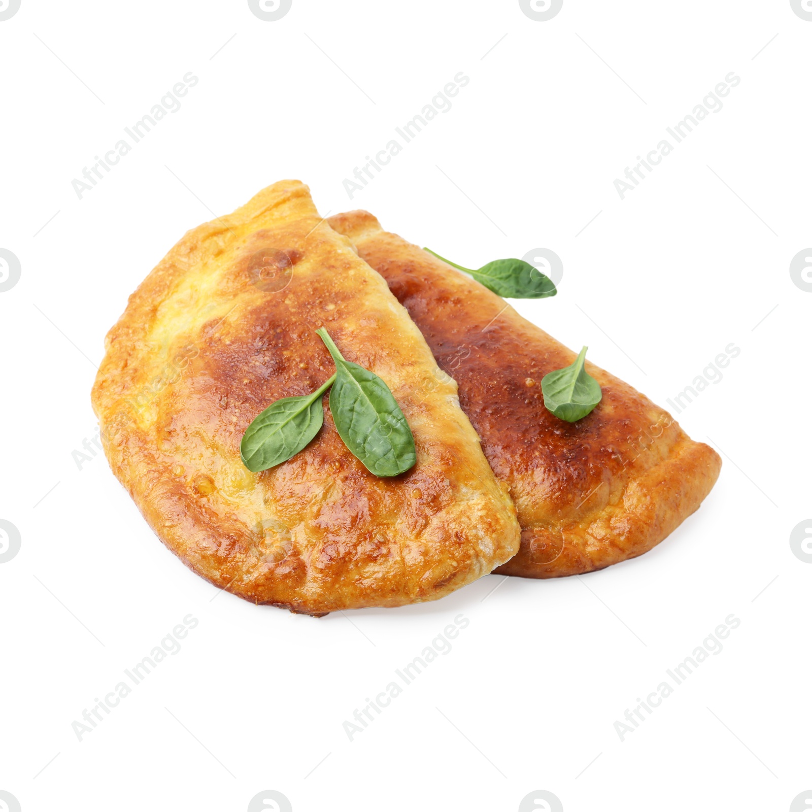 Photo of Tasty calzones with basil isolated on white