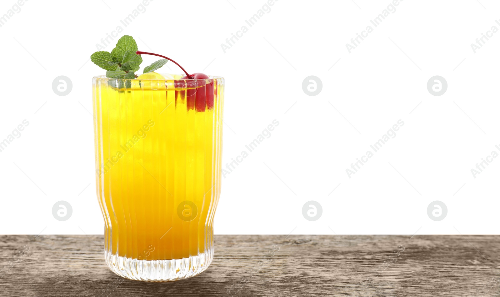 Photo of Tasty pineapple cocktail with mint and cherry in glass on wooden table against white background, space for text