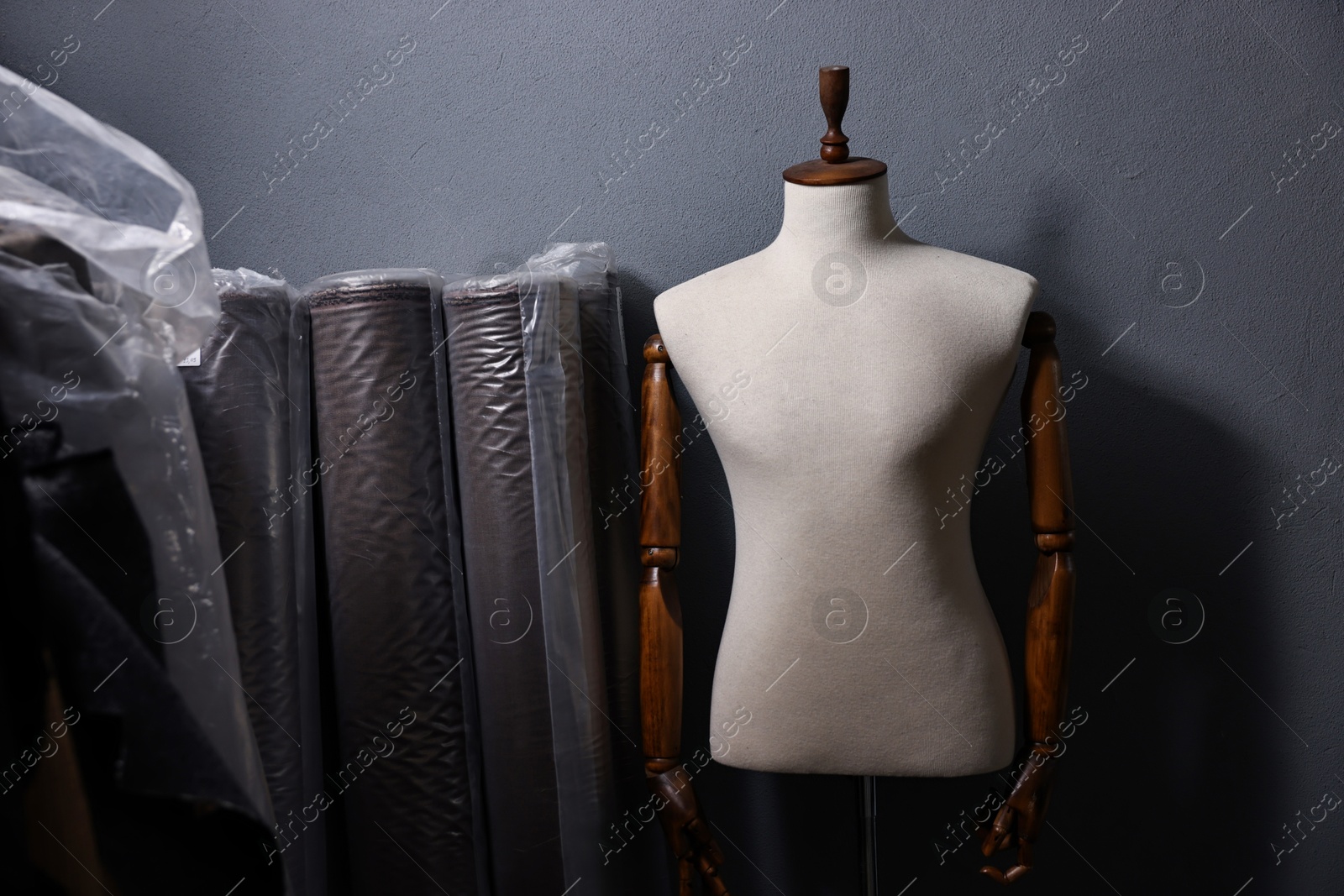 Photo of Many different types of fabric and mannequin in professional workshop