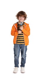 Little boy with microphone on white background