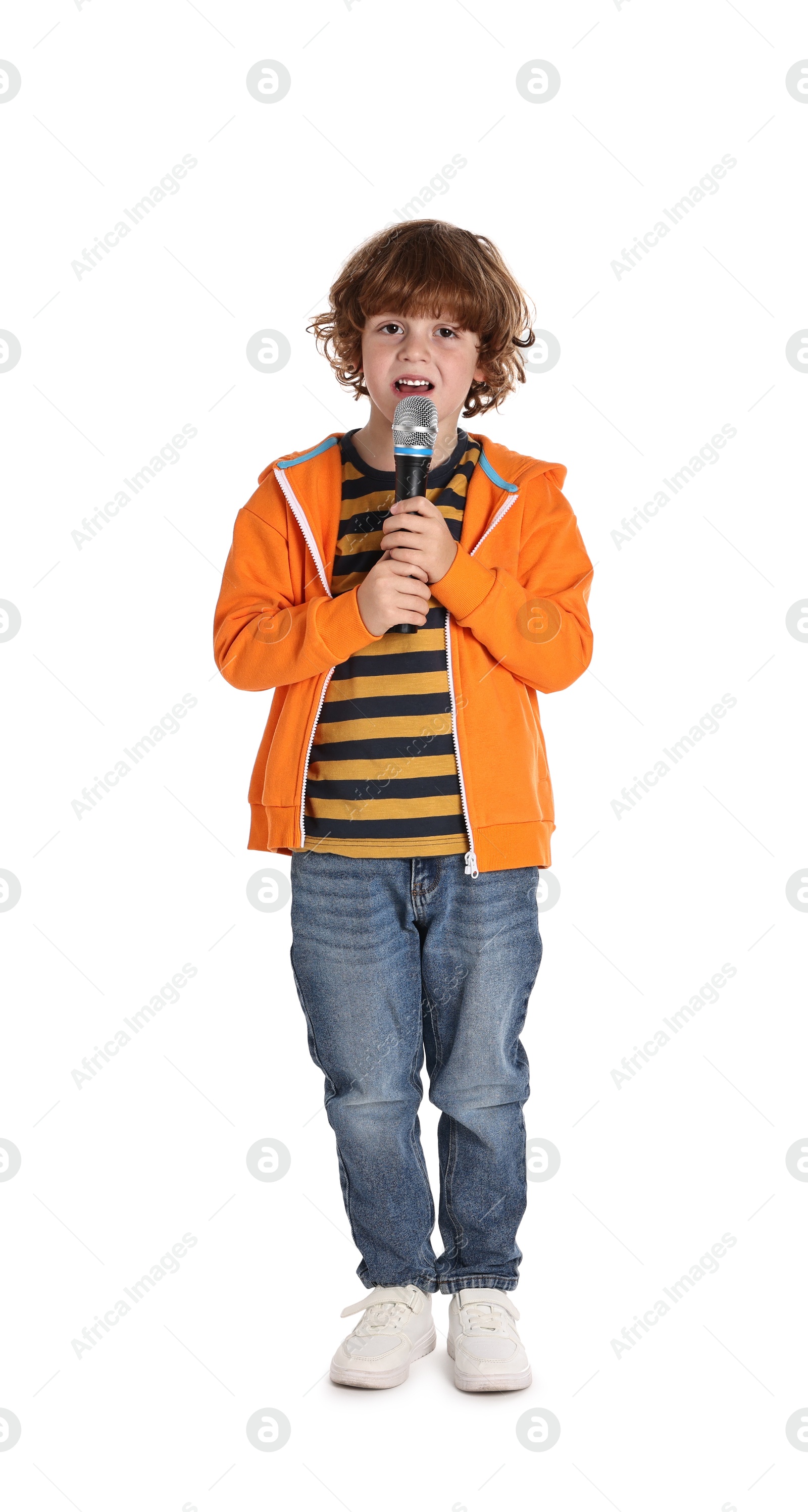 Photo of Little boy with microphone singing on white background