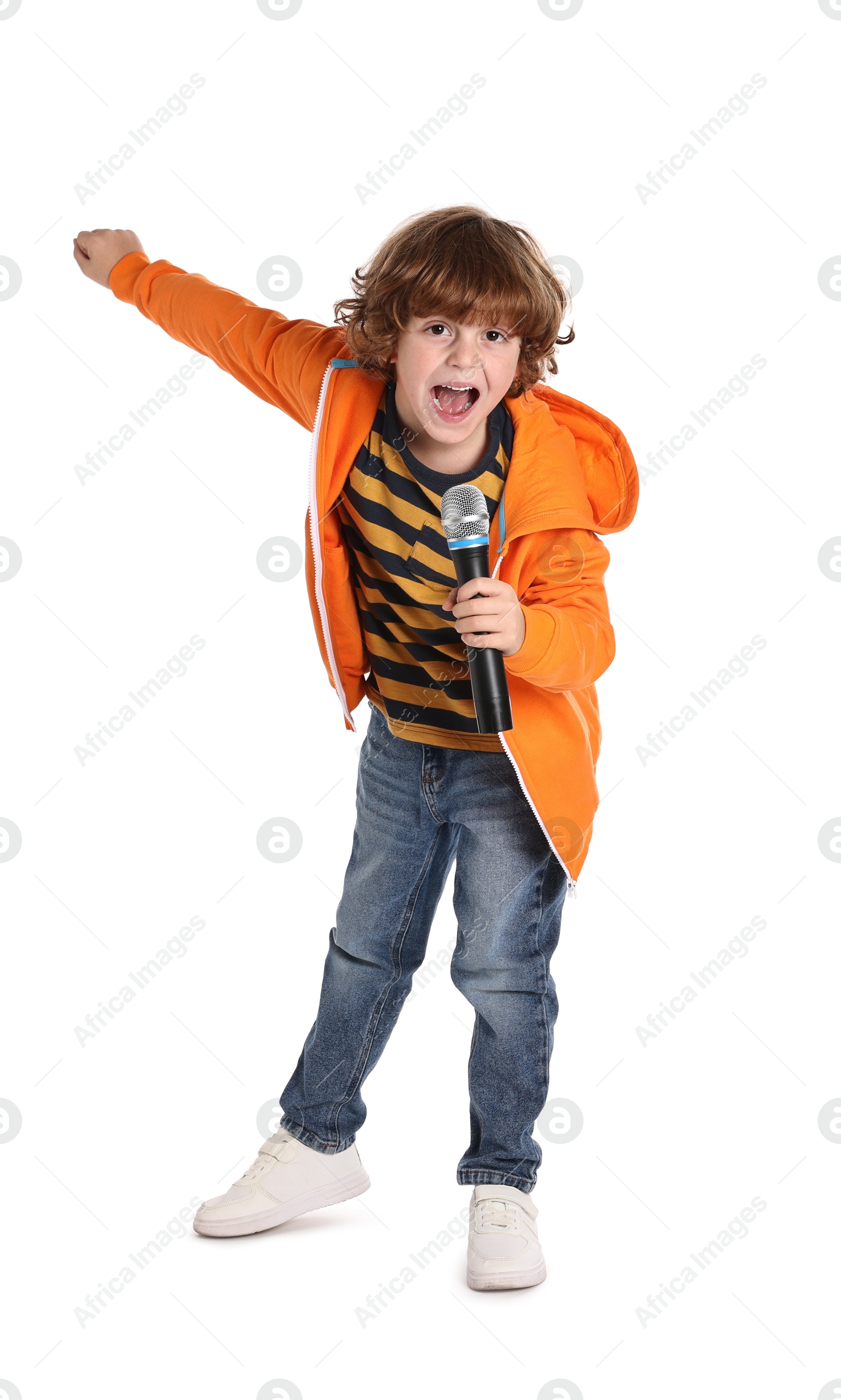 Photo of Little boy with microphone singing on white background