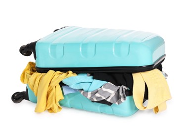 Photo of Suitcase full of different messy clothes isolated on white