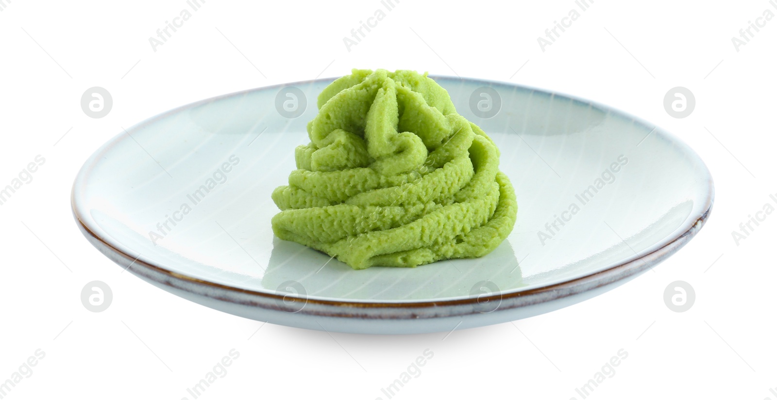 Photo of Plate with hot wasabi paste isolated on white