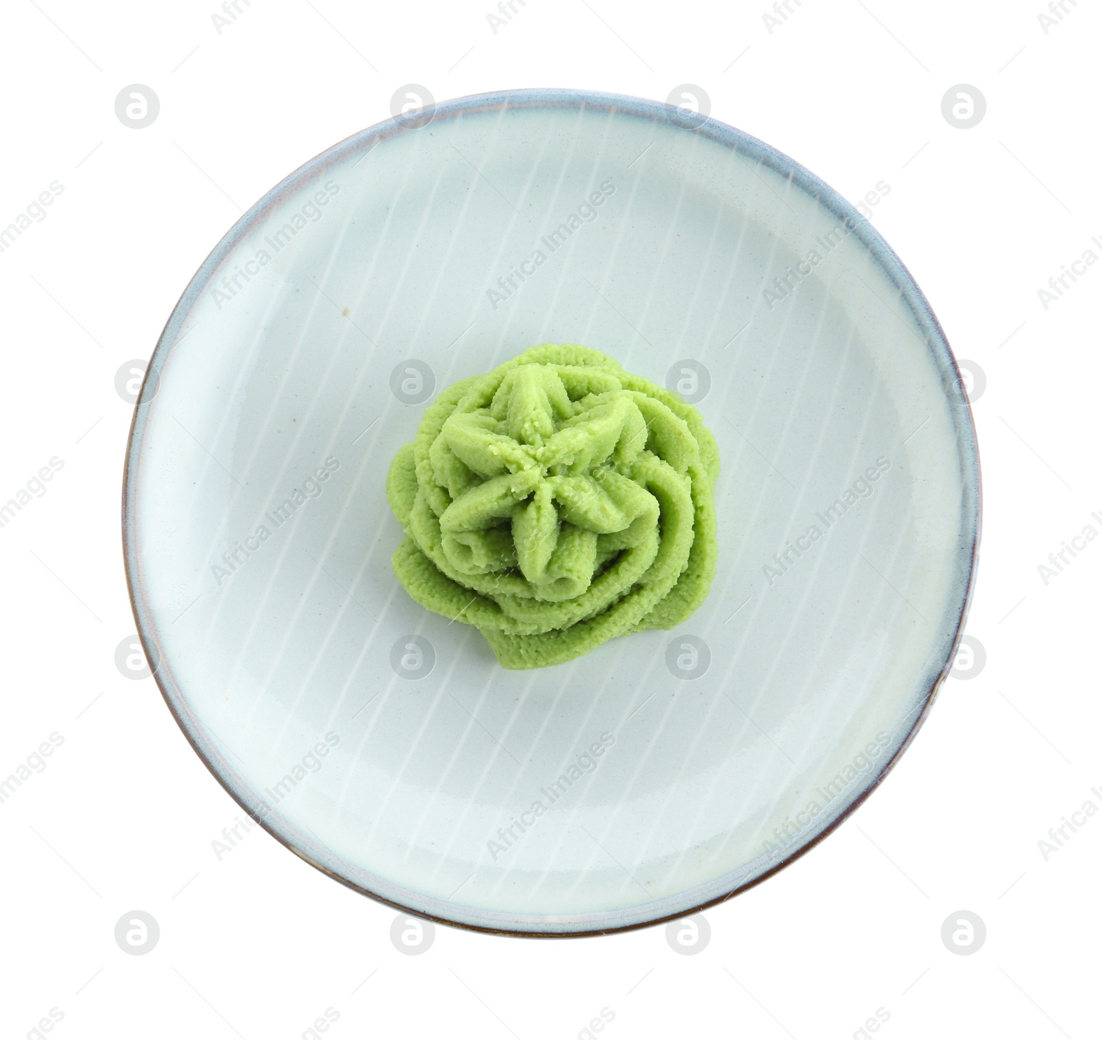 Photo of Plate with hot wasabi paste isolated on white, top view