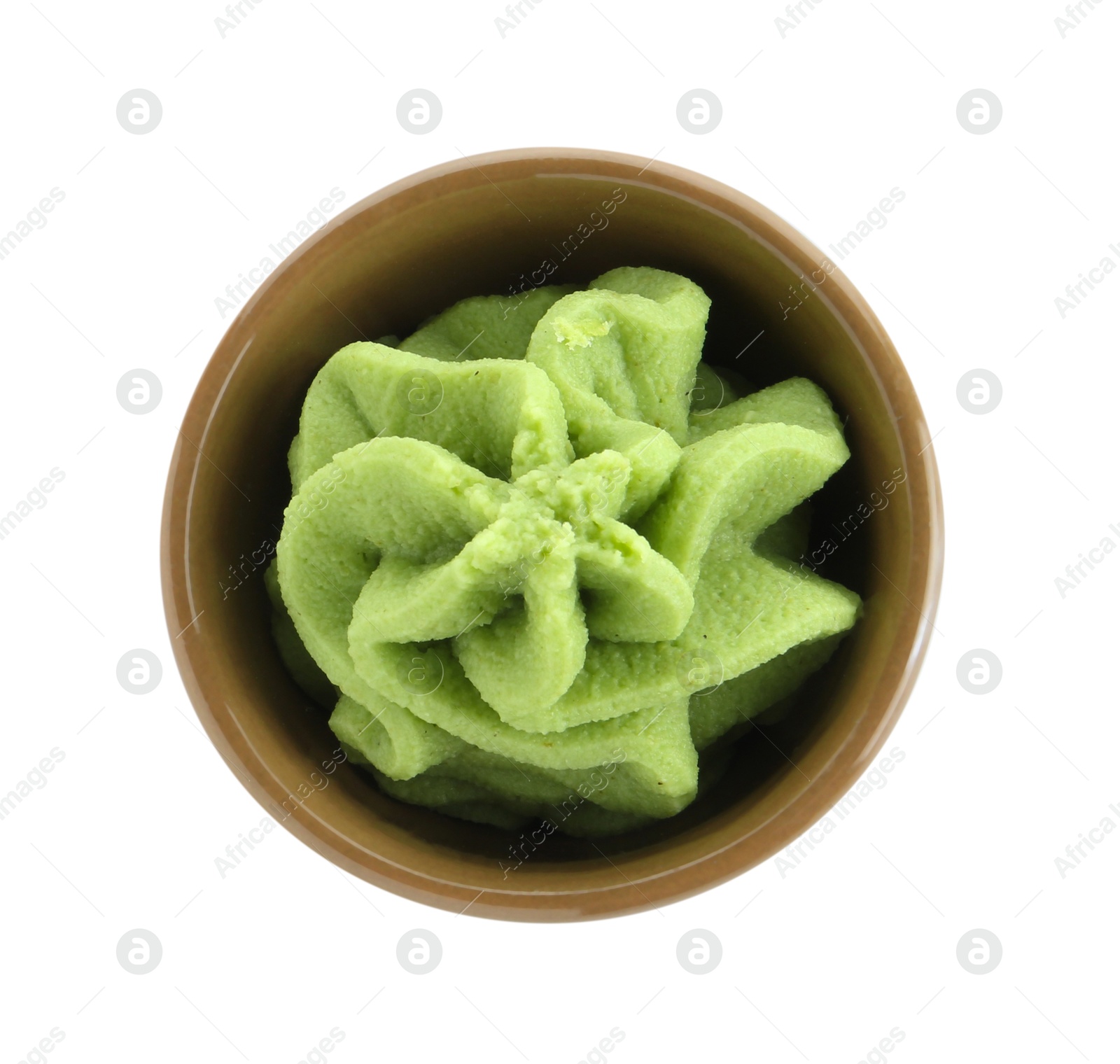 Photo of Hot wasabi paste in bowl isolated on white, top view