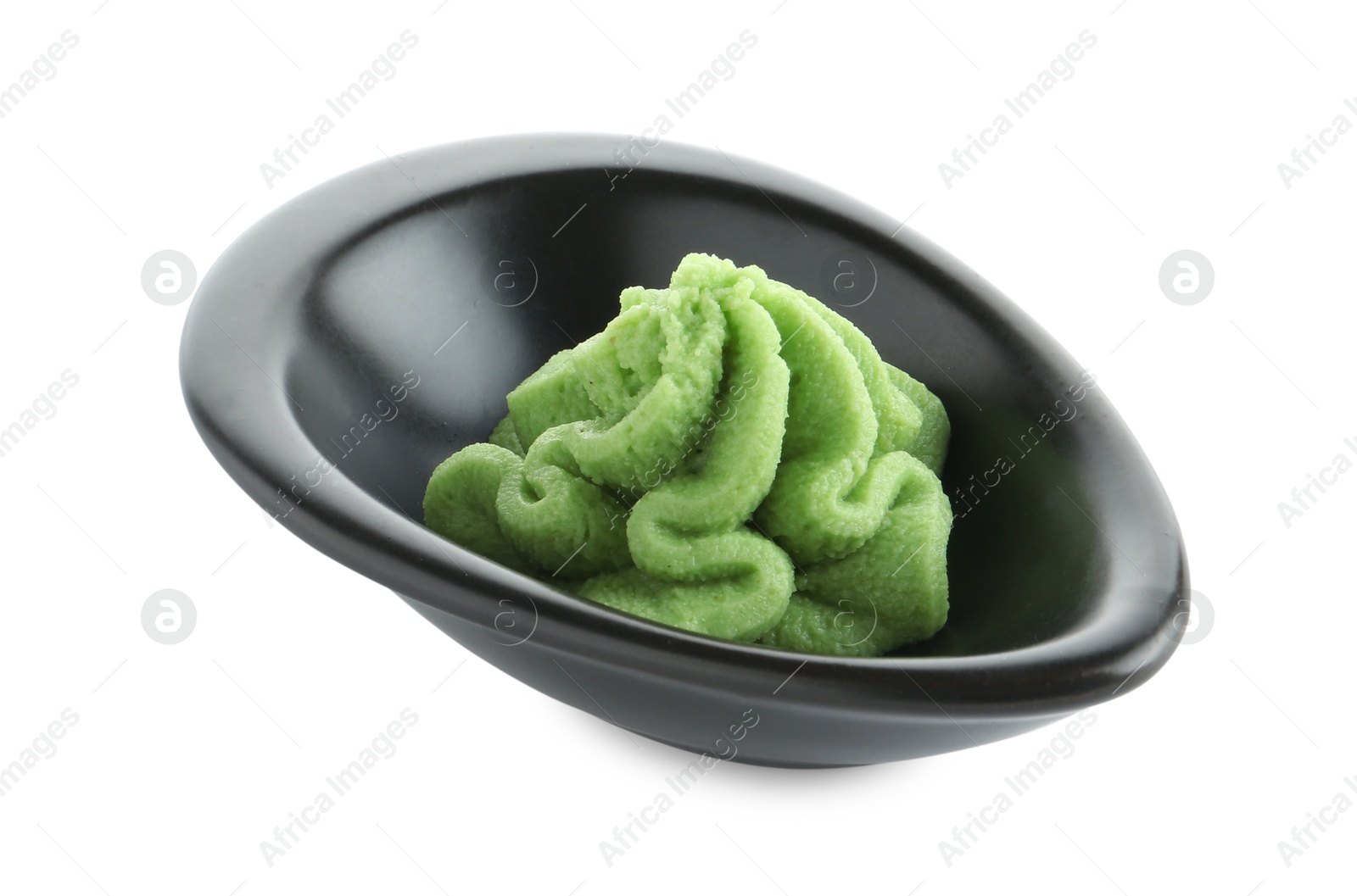 Photo of Hot wasabi paste in gravy boat isolated on white