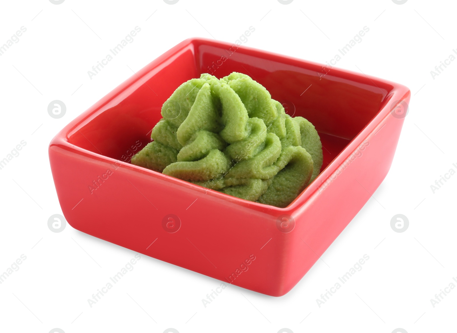 Photo of Hot wasabi paste in bowl isolated on white