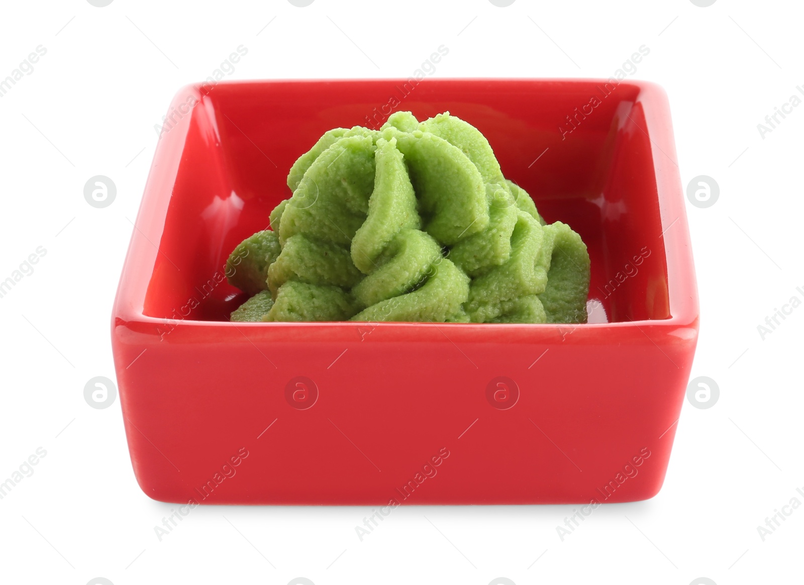 Photo of Hot wasabi paste in bowl isolated on white