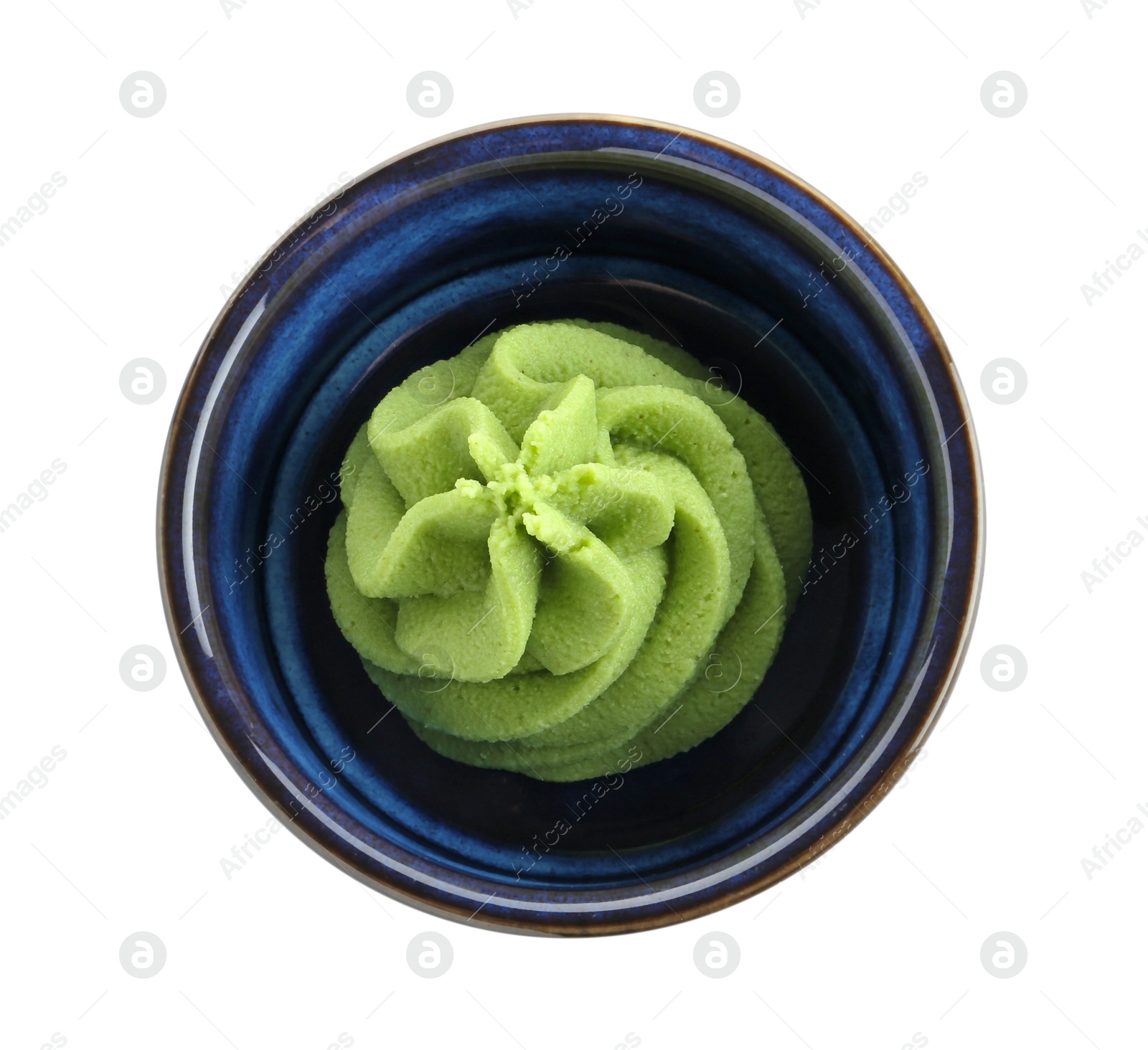 Photo of Hot wasabi paste in bowl isolated on white, top view