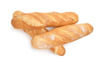 Photo of Three freshly baked baguettes isolated on white, top view