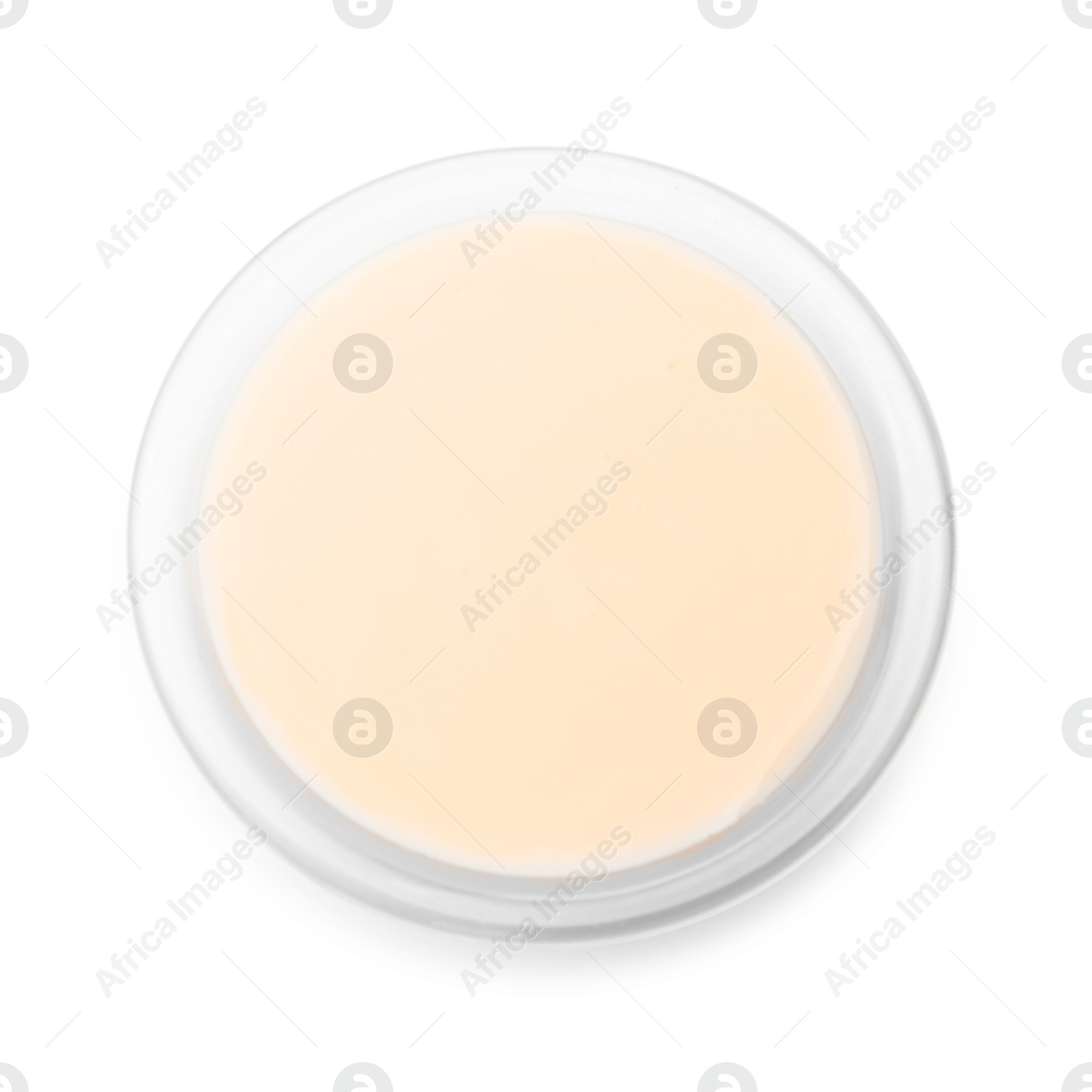 Photo of Condensed milk in bowl isolated on white, top view