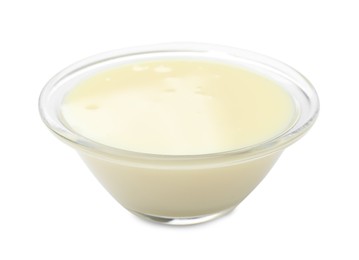 Photo of Condensed milk in bowl isolated on white