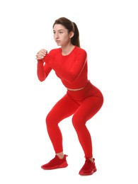 Photo of Woman in sportswear exercising on white background