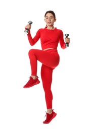 Photo of Woman in sportswear exercising with dumbbells on white background