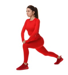 Photo of Woman in sportswear exercising on white background