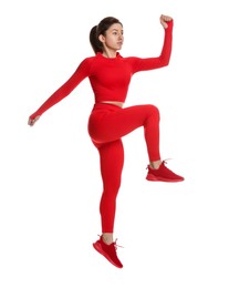 Photo of Woman in sportswear exercising on white background