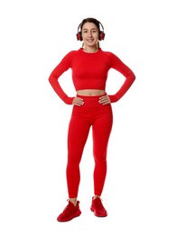 Photo of Woman in sportswear and headphones on white background