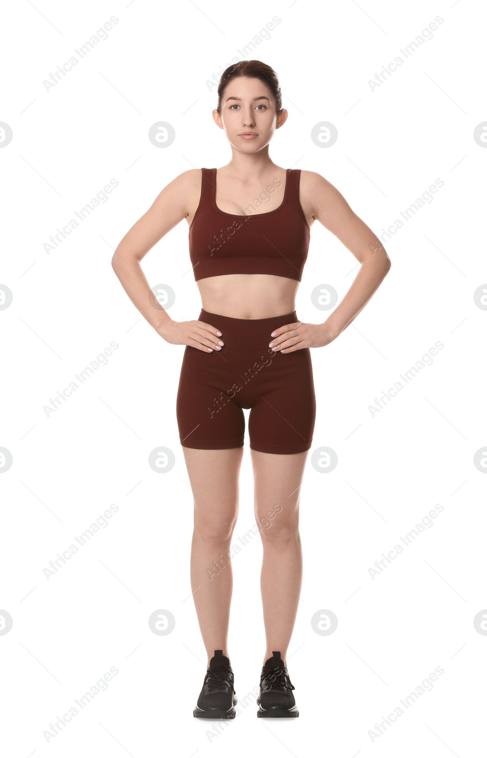 Photo of Portrait of woman in sportswear on white background