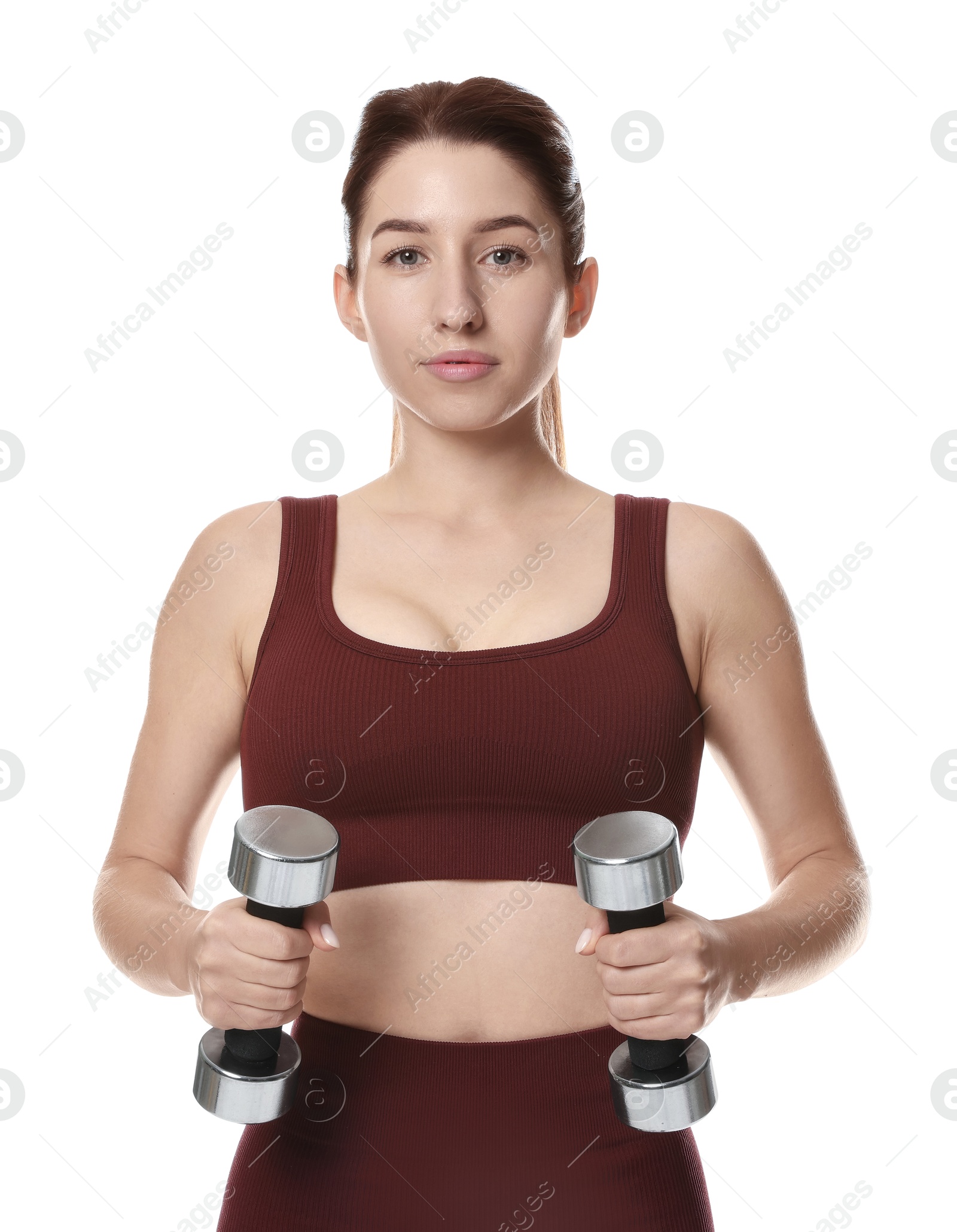 Photo of Woman in sportswear exercising with dumbbells on white background