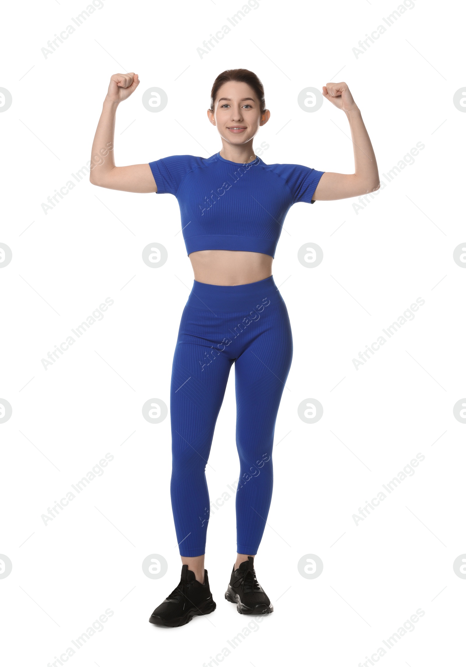 Photo of Portrait of woman in sportswear on white background