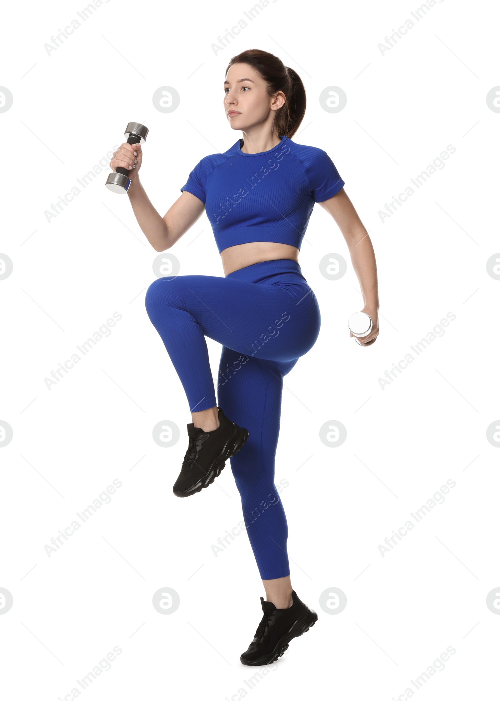 Photo of Woman in sportswear exercising with dumbbells on white background