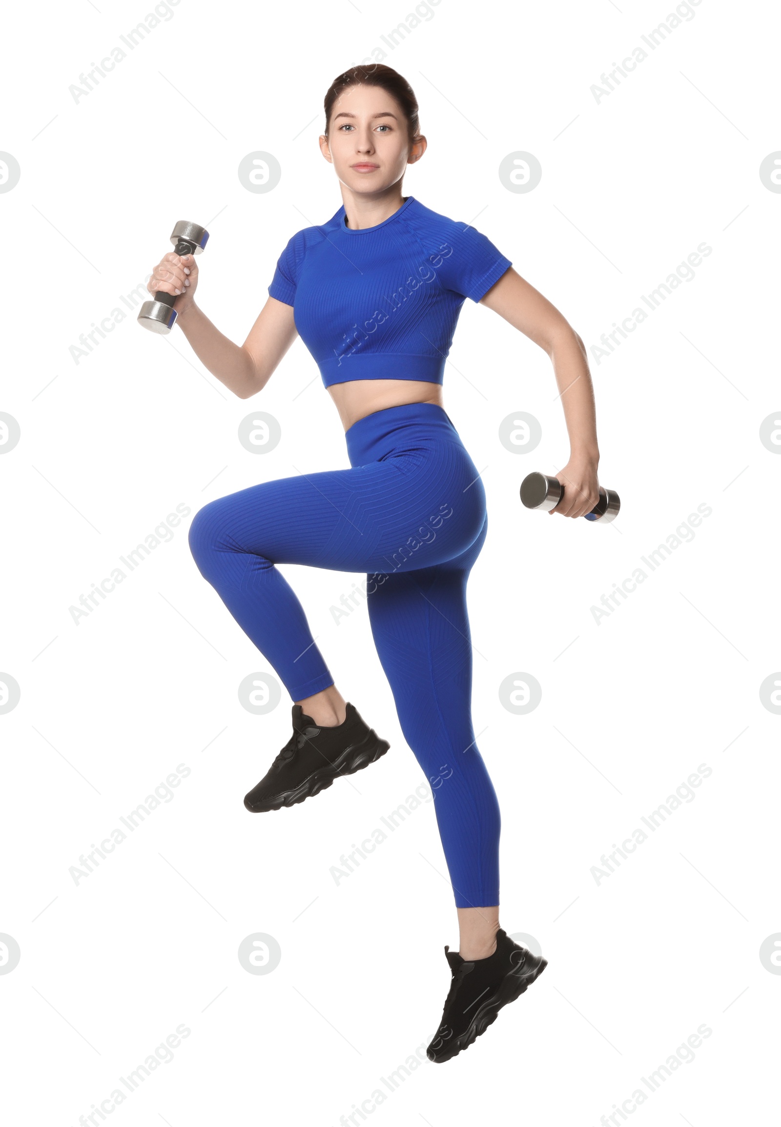 Photo of Woman in sportswear exercising with dumbbells on white background