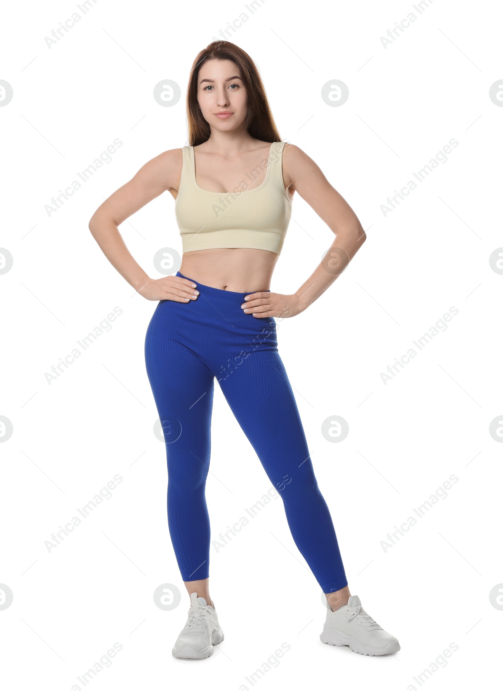 Photo of Portrait of woman in sportswear on white background